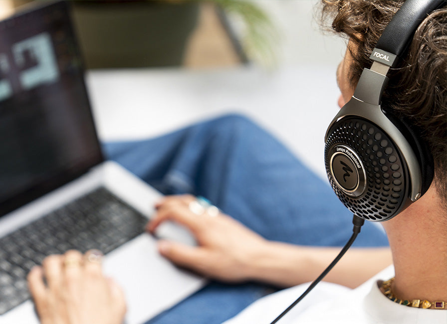 Focal Lensys Professional studio headphones with over-ear design, featuring sleek black ear cups and a padded headband for comfortable listening.