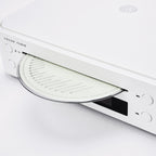 Argon Audio CD1 White loading a disc into the slot-loading CD drive