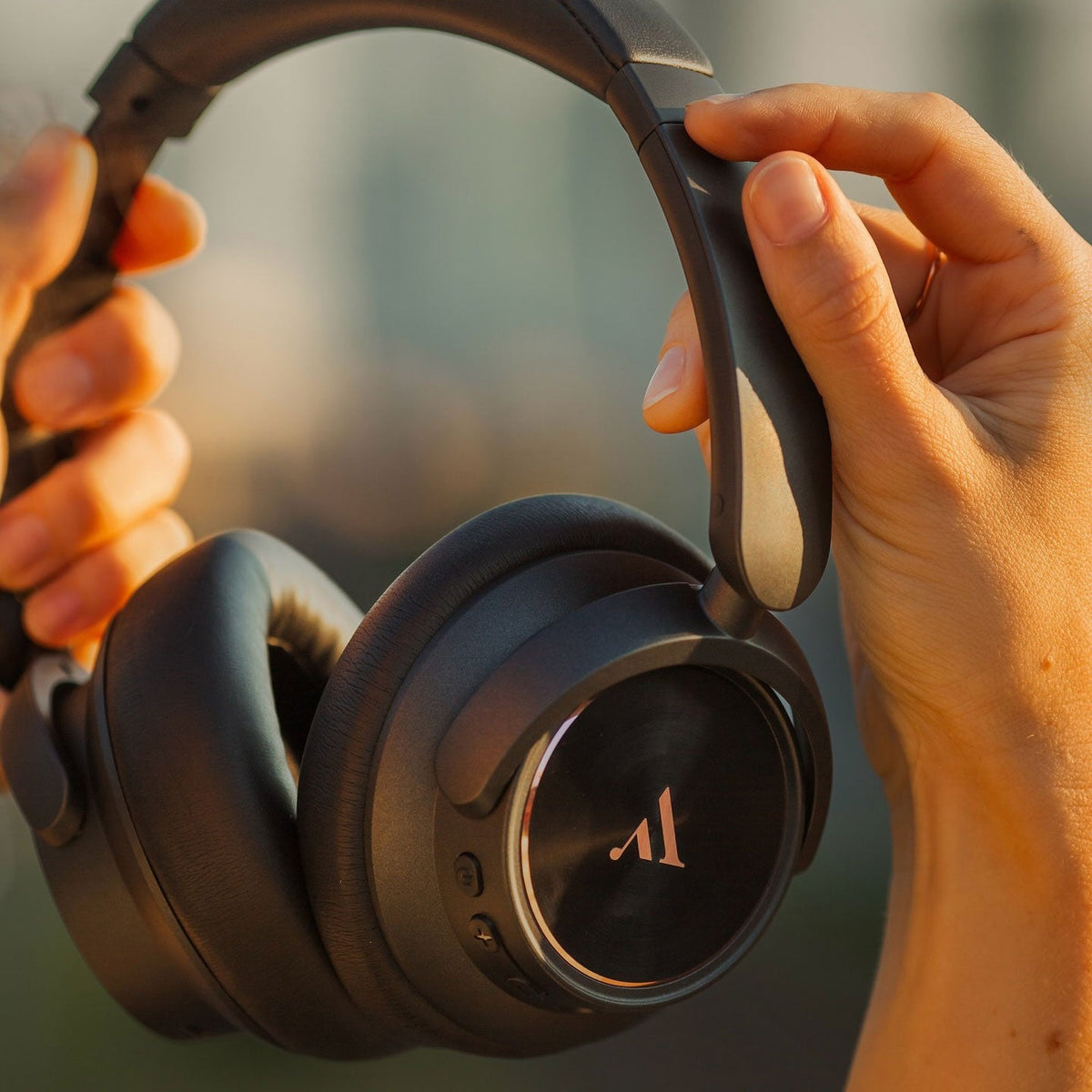 Argon Audio Quiet Storm Black held in two hands, ear cup detail
