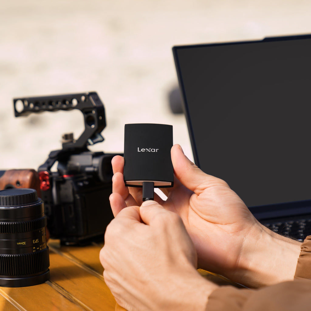 Lexar Armor 700 portable external SSD with rugged design and USB-C connection, displayed on a sleek surface.