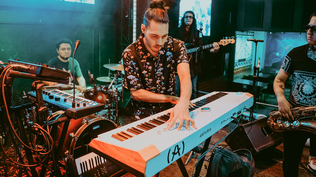 Arturia AstroLab 88 performance keyboard with 88 keys, black finish, and control knobs for music production and live performance.