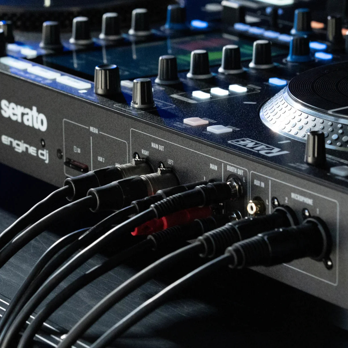 Rane System One DJ controller with jog wheels, mixer controls, and connectivity options for professional DJ setups.