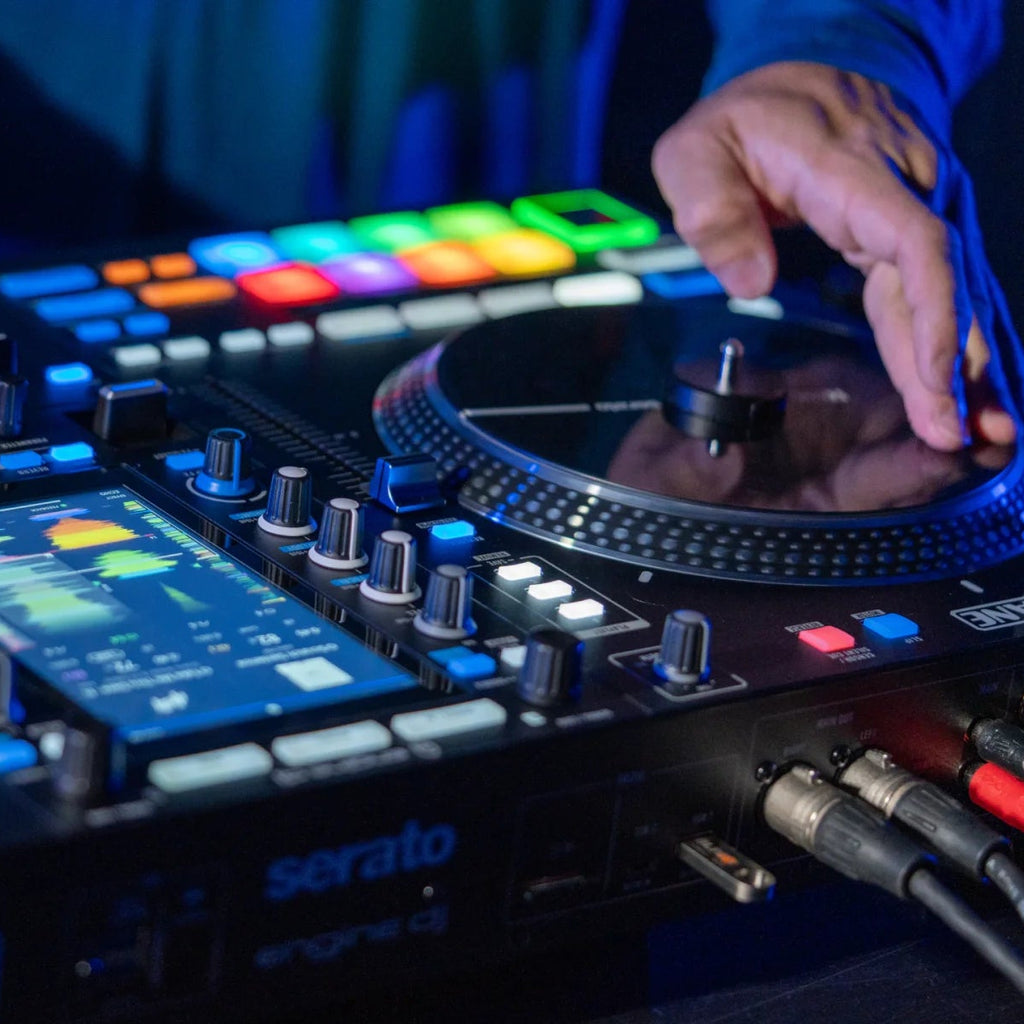 Rane System One DJ controller with multi-channel mixer, jog wheels, and control knobs for professional DJ setup.