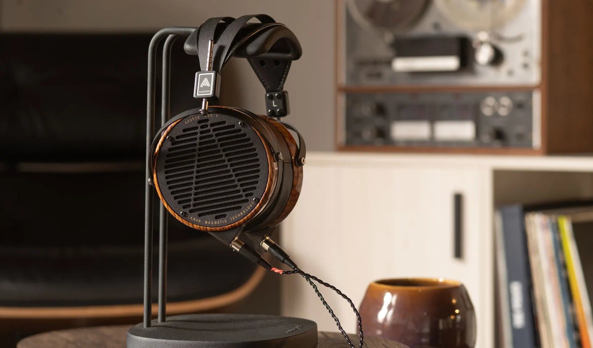 Audeze LCD-3 wired headphones with leather ear cups and headband, featuring open-back design and high-quality audio drivers.