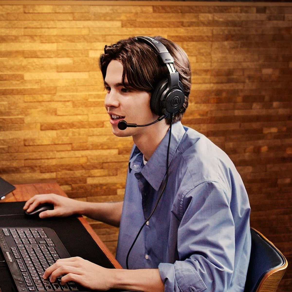 Audio-Technica ATH-M20xSTS streaming headset worn at a desk