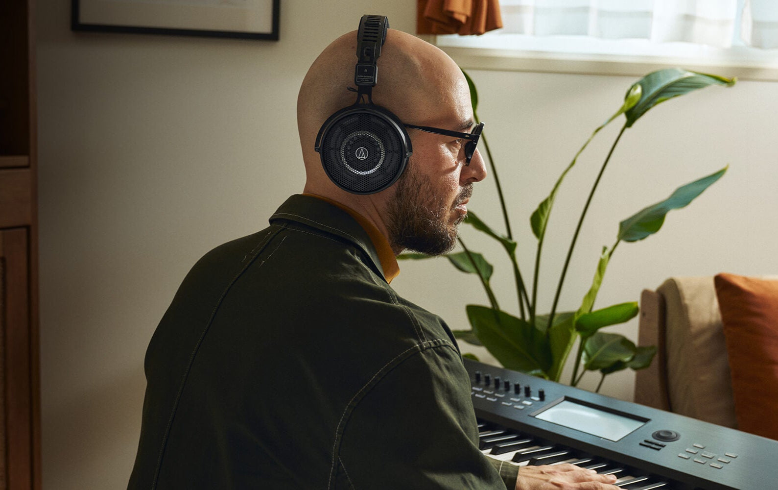 Audio-Technica ATH-R50x open-back studio headphones, top view, in use