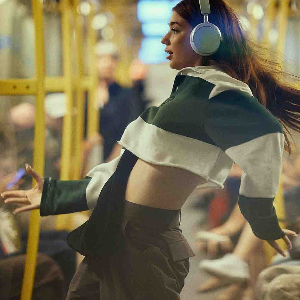 Beyerdynamic Aventho Y in Soft Jade worn on a tram