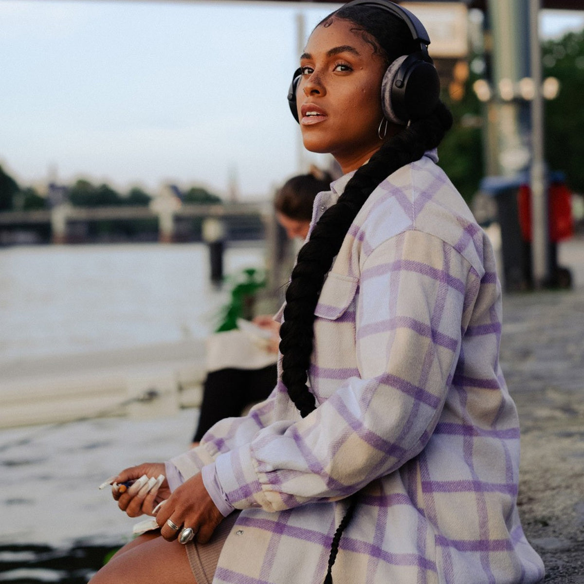 Listener outdoors using Beyerdynamic Pro X headphones with the Pro X USB-C Cable