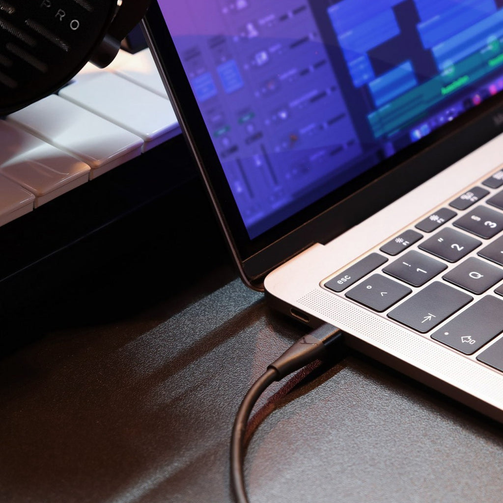Beyerdynamic Pro X USB-C Cable plugged into a laptop USB-C port