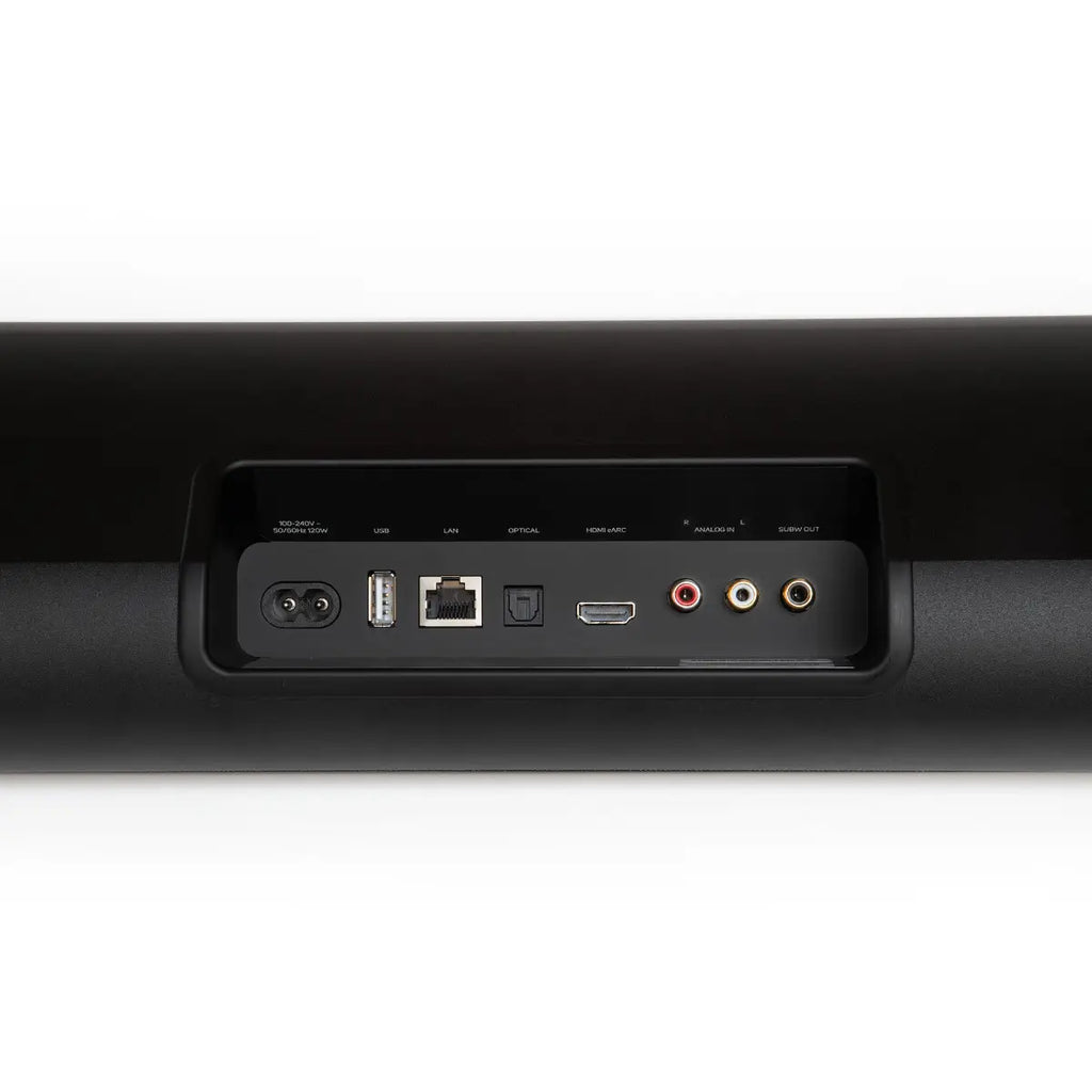 Bluesound Pulse Cinema soundbar with black connection panel, featuring audio ports and sleek TV speaker design.