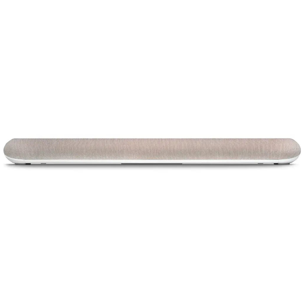 Ivory Bluesound Pulse Cinema Mini soundbar with sleek front design, placed on a table, showcasing compact home theater audio.