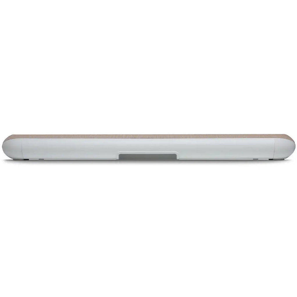 Bluesound Pulse Cinema Mini soundbar in ivory, rear view on a tabletop showing sleek design and speaker grille.