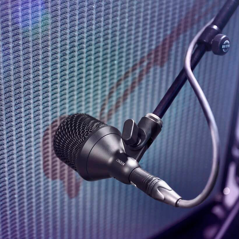 Shure Nexadyne 2 dynamic microphone with black body and grille, designed for professional audio and vocal performances.