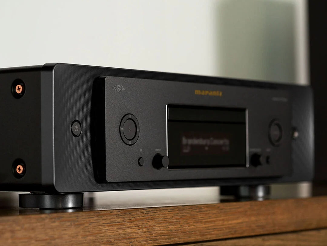 Marantz CD 50n portable music player with a sleek design, featuring a compact shape and control buttons on the front.