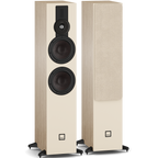 DALI Sonik 7 passive floorstanding speakers with sleek black cabinets and multiple drivers for high-quality sound in a home audio setup.