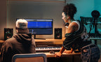 Mackie CR4.5 desktop speakers with black enclosures and control knobs on the front panel, designed for audio monitoring.