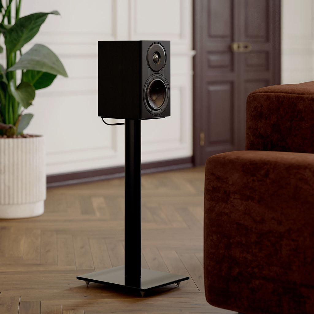 DALI Sonik 1 passive bookshelf speakers with black wood finish, showcasing sleek design and front grille in the image.