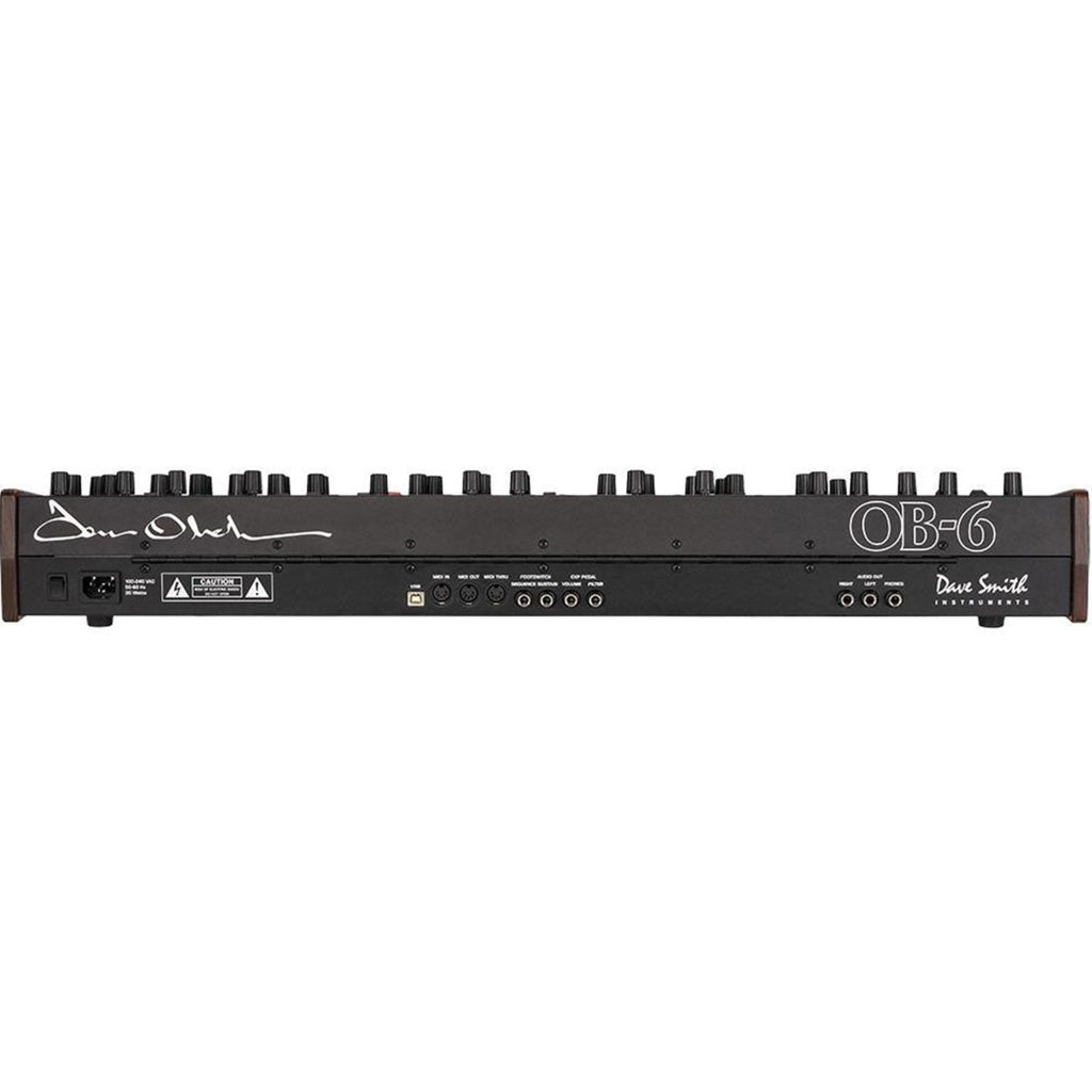 Sequential OB-6 synthesizer with a sleek control panel and knobs, designed for rich, analog sound production.
