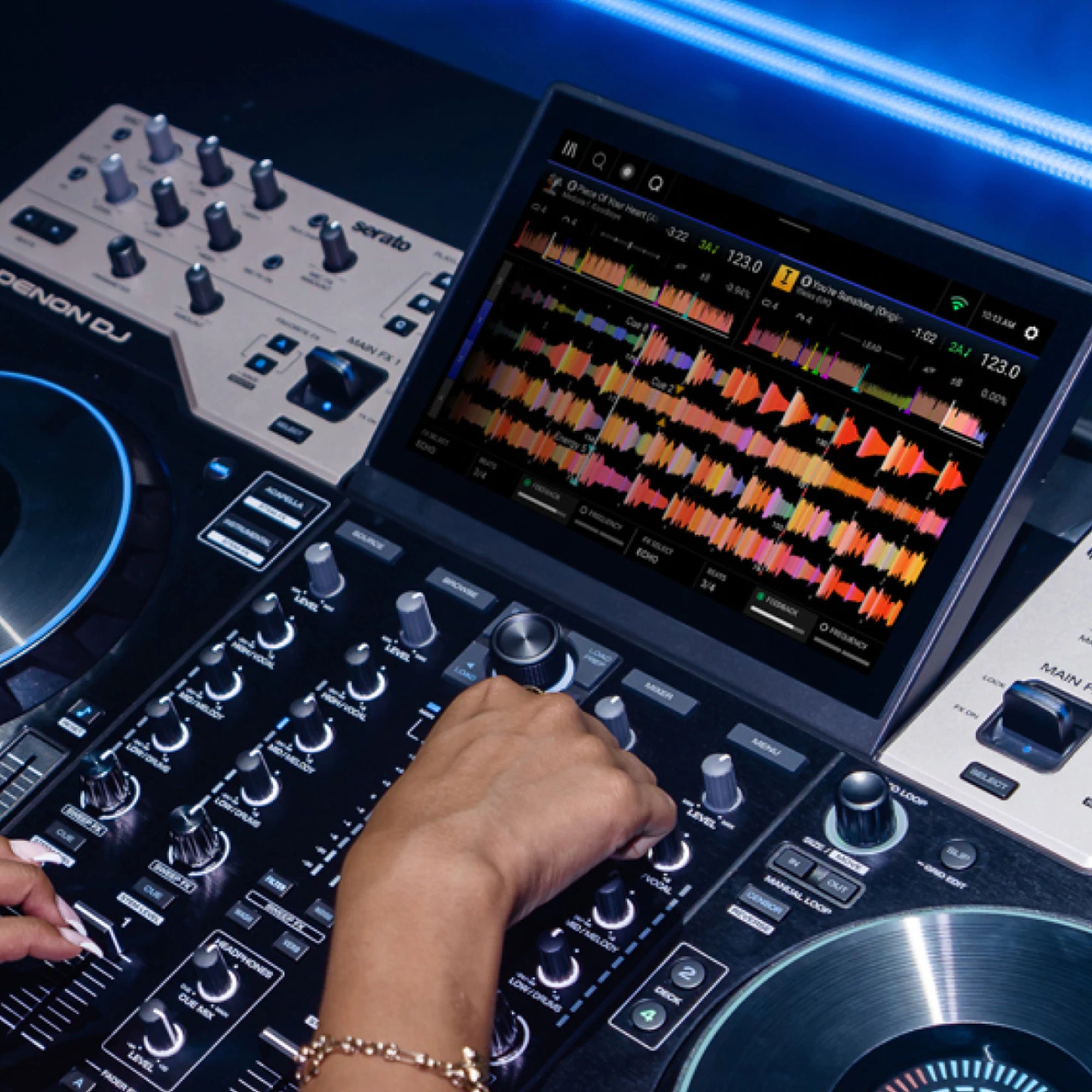 Denon DJ Prime 4 G2, DJ mixing on the 10.1-inch touchscreen during a set
