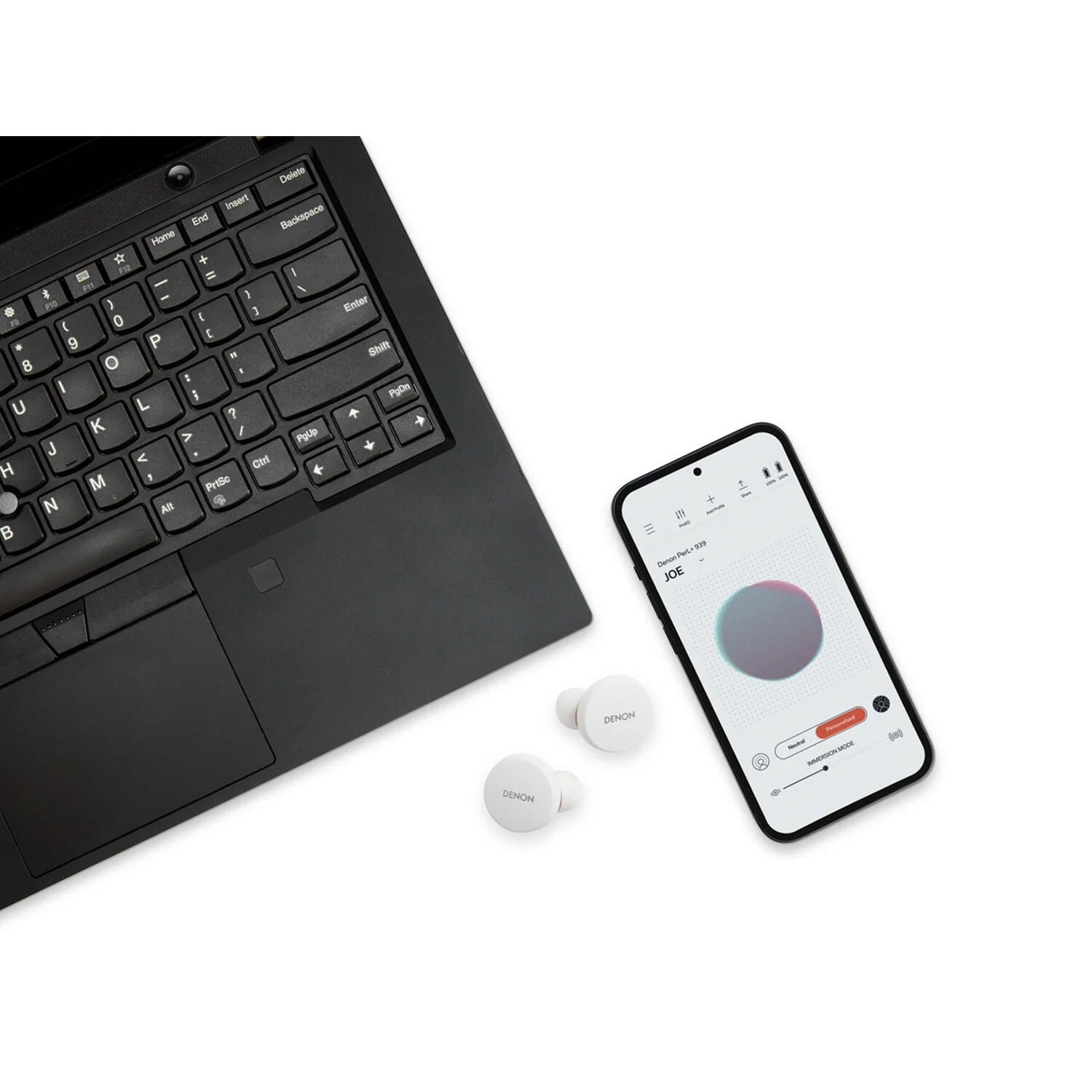 Denon PerL wireless in-ear headphones, lifestyle with companion app on laptop and phone