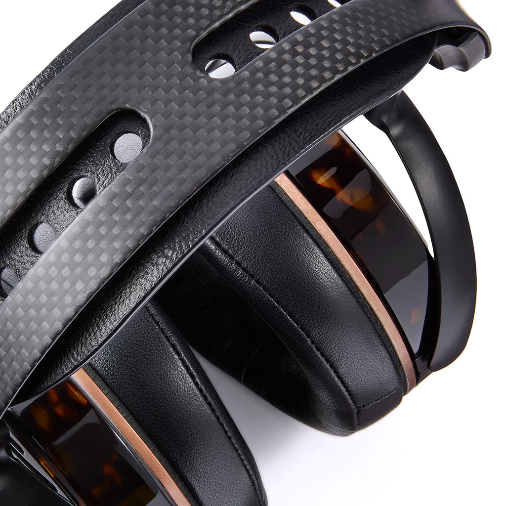 Audeze LCD-5s wired headphones with sleek black ear cups and a sturdy headband, showcasing premium audio design and craftsmanship.