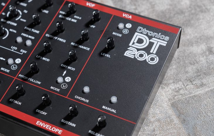 Dtronics DT-200 V3 synthesizer with knobs and interface, showcasing its compact electronic music instrument design.