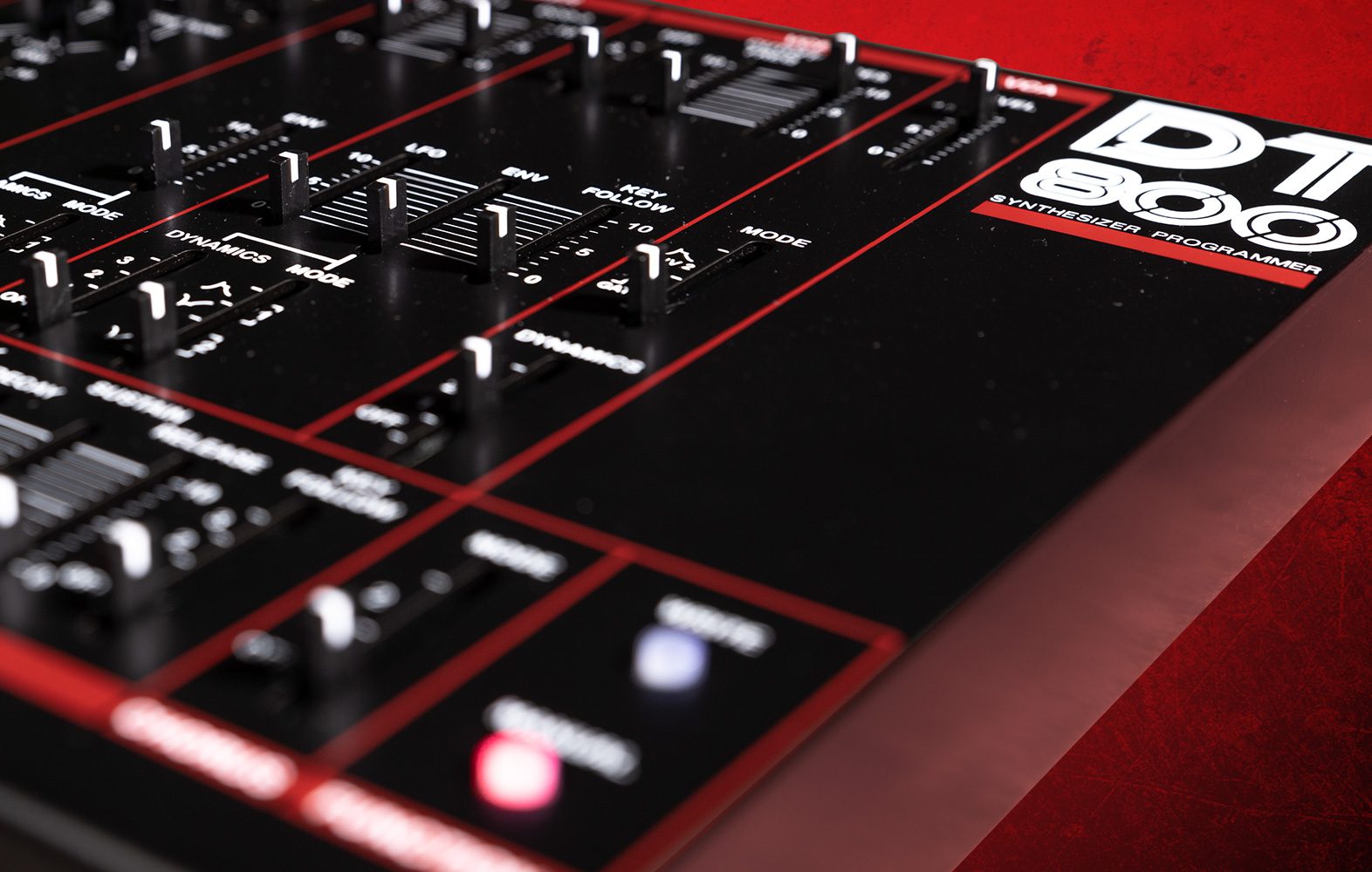 Dtronics DT-800 synthesizer with multiple knobs and sliders, showcasing front panel controls and colorful LED displays.