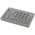 Elektron Model:Cycles drum machine and sampler with colorful pads and sleek black design, used for electronic music production.