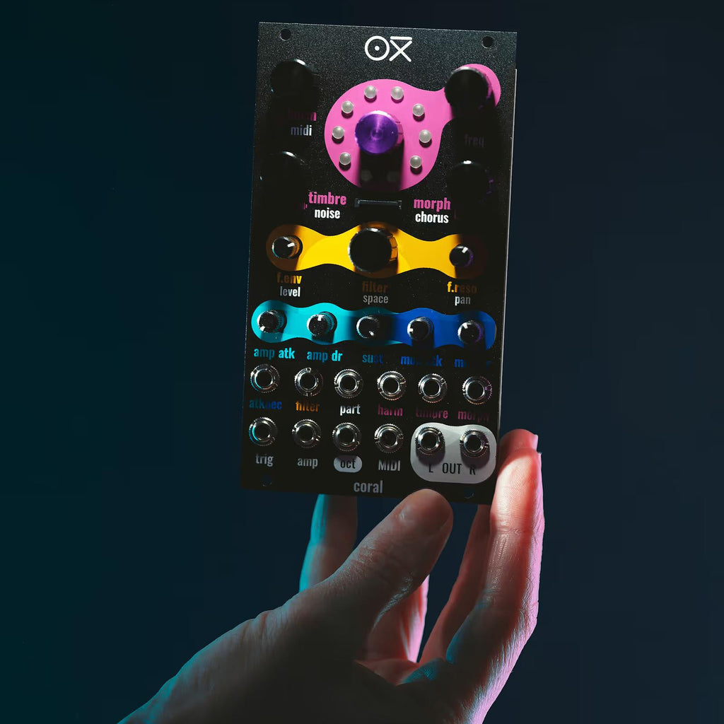OXI Instruments Coral semi-modular synthesizer with colorful engine modules and patch cables, showcasing its complex sound design features.