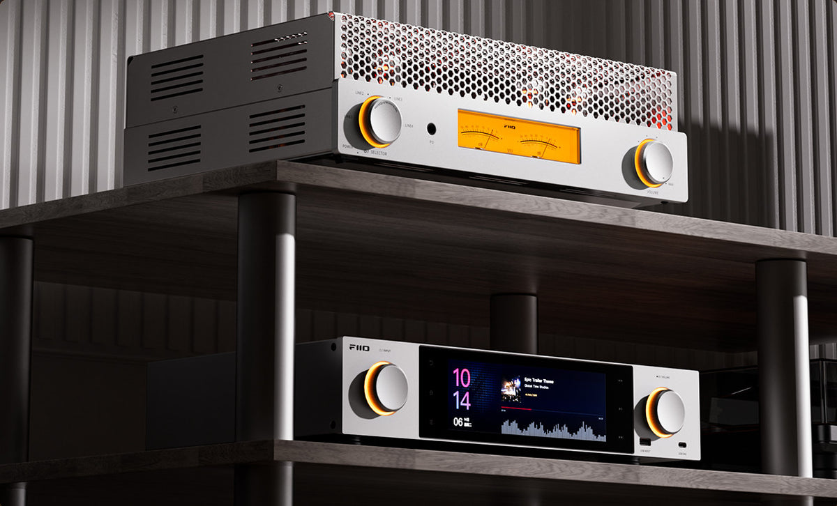FiiO EA13 in silver stacked above a FiiO desktop streamer on a hi-fi rack
