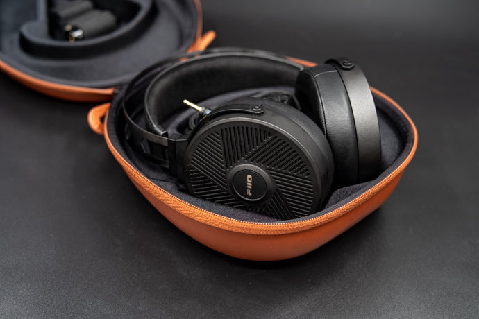 FiiO FT5 wired headphones with sleek black design and in-ear fit, featuring detachable cables and ergonomic ear tips.