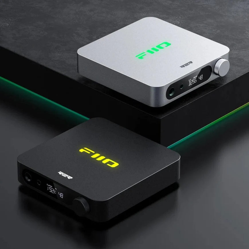 FiiO K11 R2R headphone amplifier and DAC, in black, lifestyle setting
