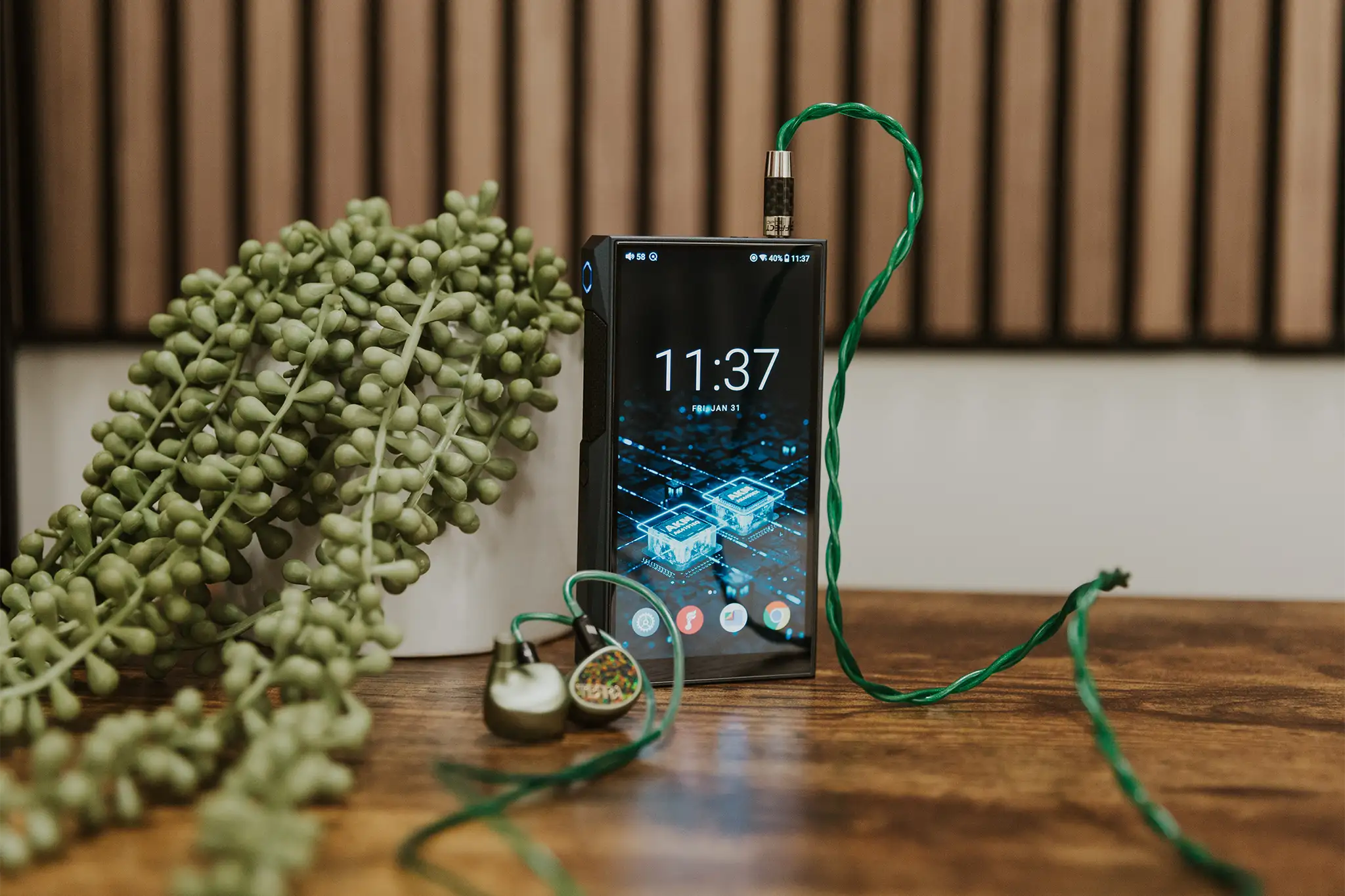 FiiO M23 portable music player with sleek black design, touchscreen display, and headphone jack, ideal for high-resolution audio.