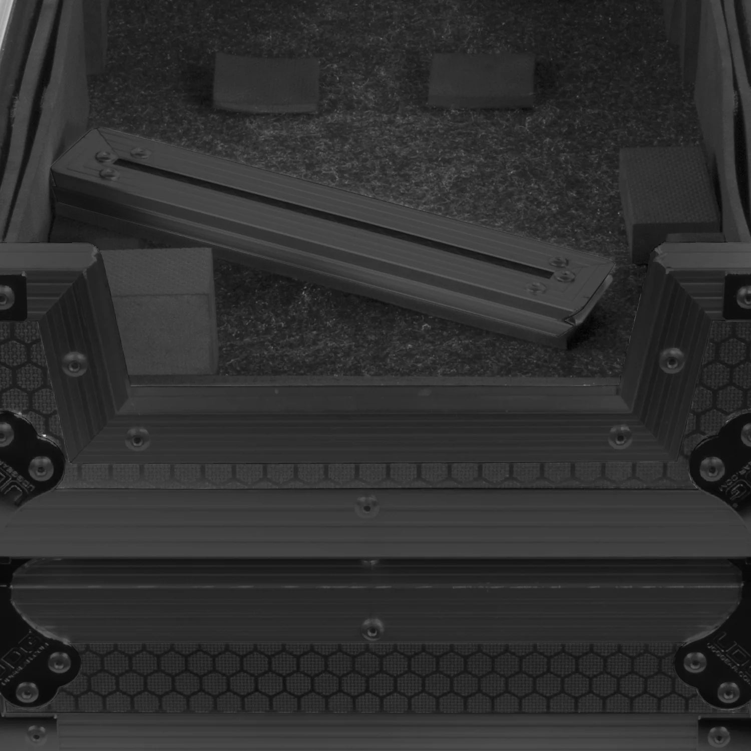 UDG Ultimate Flight Case AlphaTheta DDJ-GRV6 black DJ flight case with laptop shelf and access panel for DJ gear storage.
