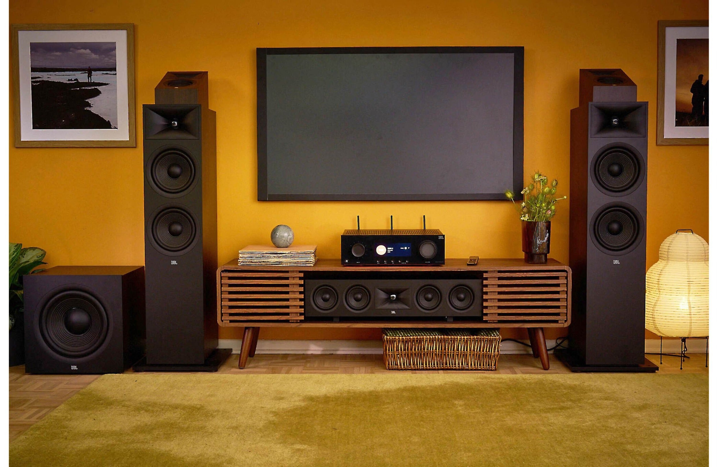 JBL MA7100HP stereo amplifier with black metal casing and control knobs, designed for high-fidelity audio amplification.