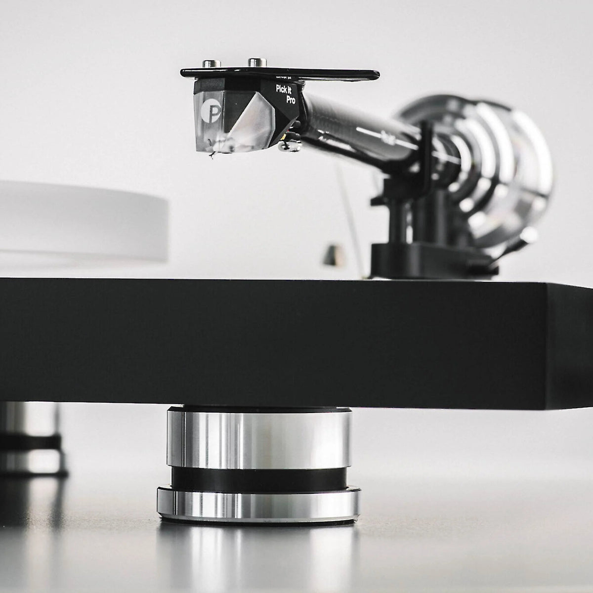 Pro-Ject Debut Reference 10 manual turntable with sleek design and tonearm, showcasing high-quality audio equipment.