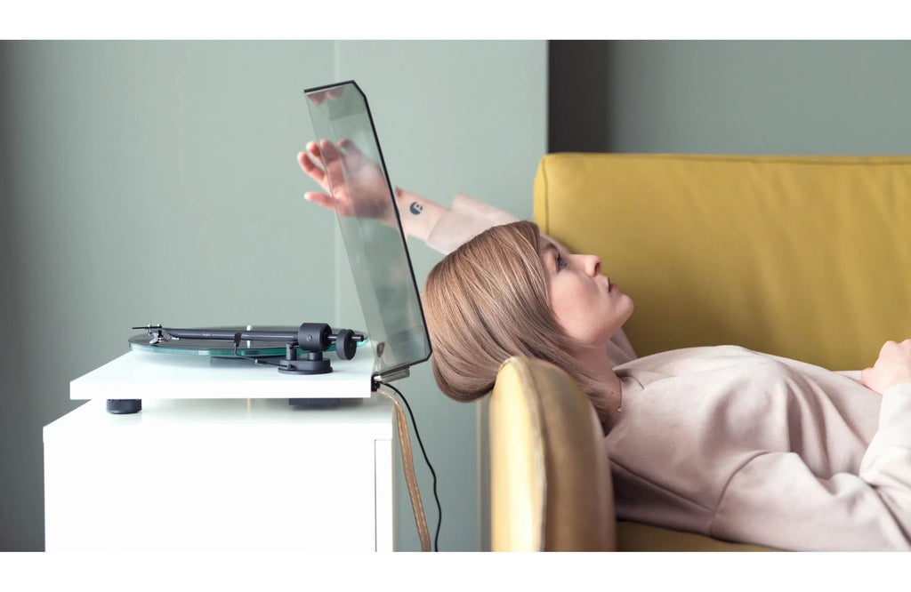 Pro-Ject T1 EVO turntable with sleek design, wooden plinth, and tonearm for high-quality vinyl listening.