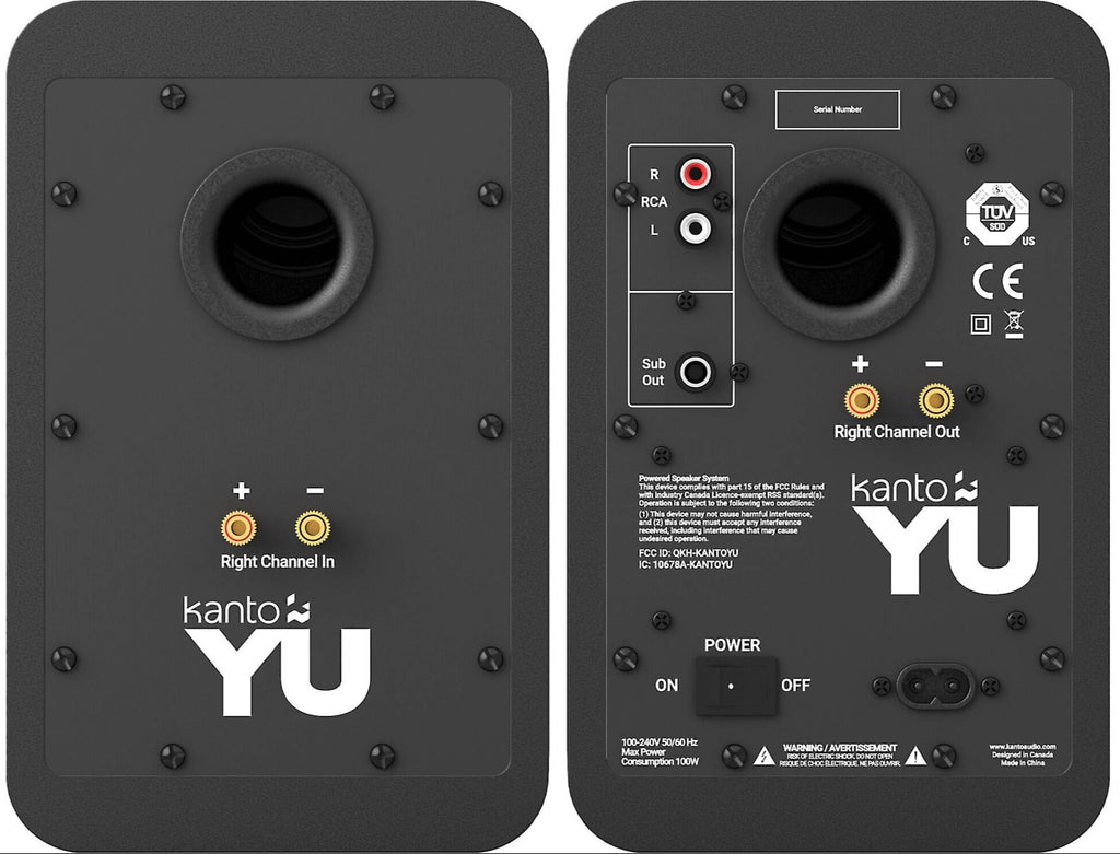 Kanto Audio YU wireless speakers with sleek black design, compact shape, and control buttons on the front panel.