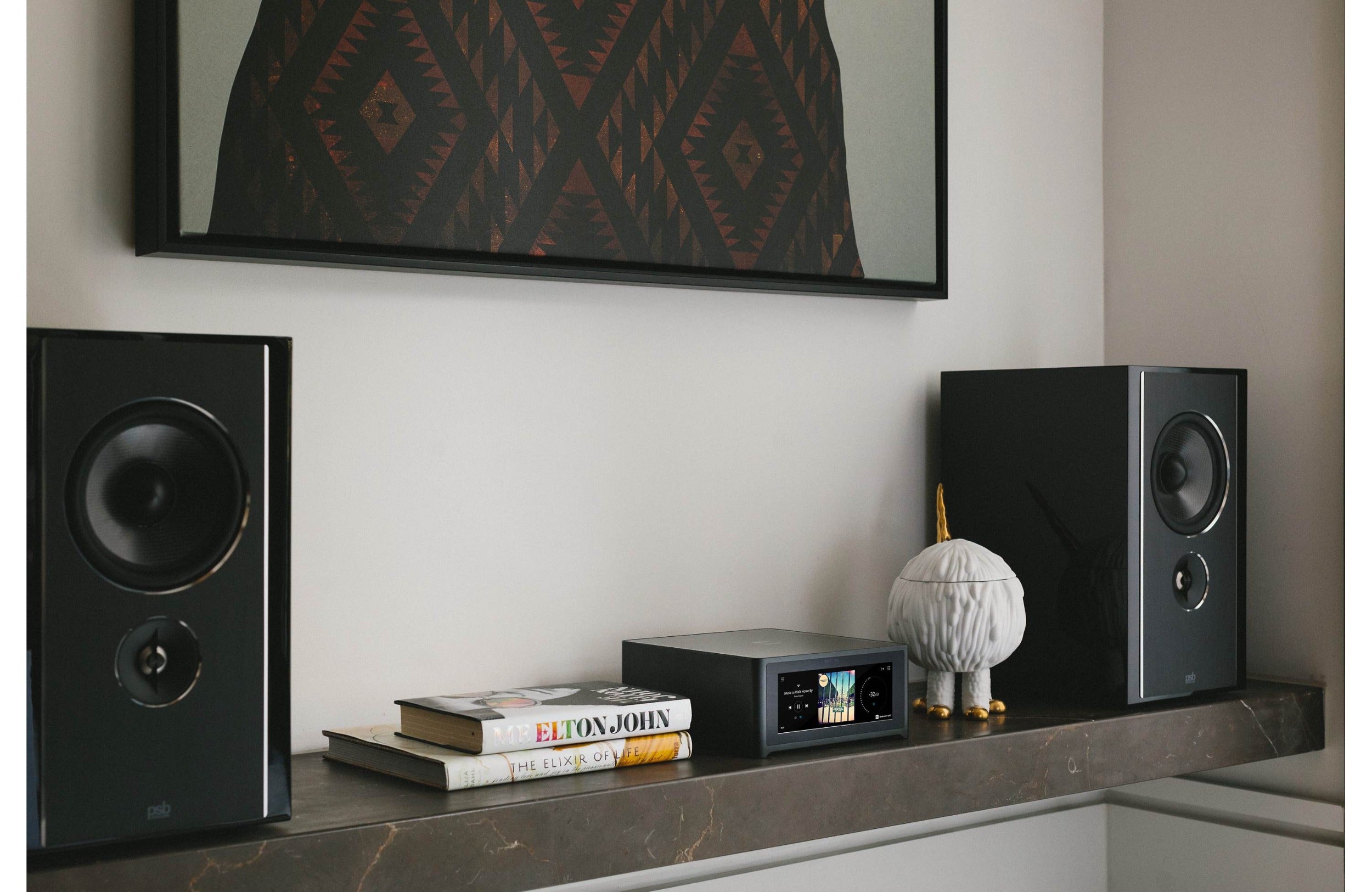 NAD M10 V3 stereo amplifier with sleek black finish and front control panel, showcasing modern audio equipment design