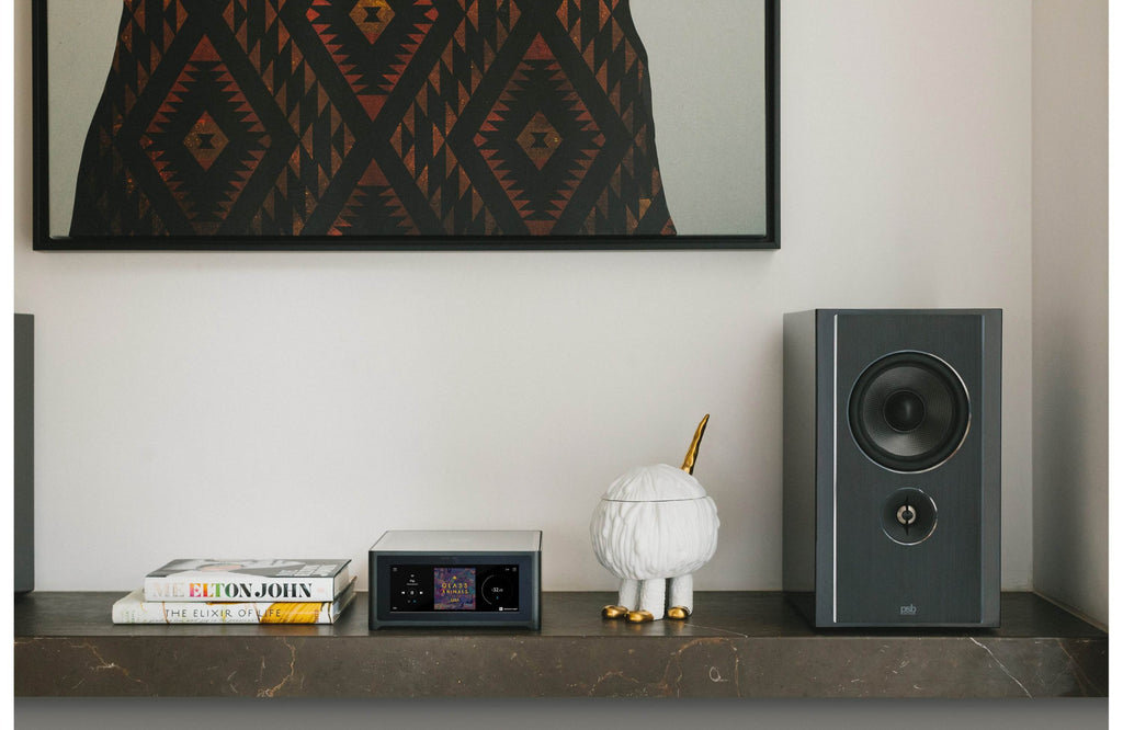 NAD M10 V3 stereo amplifier with sleek black design and control knobs, showcasing high-end audio equipment for premium sound.
