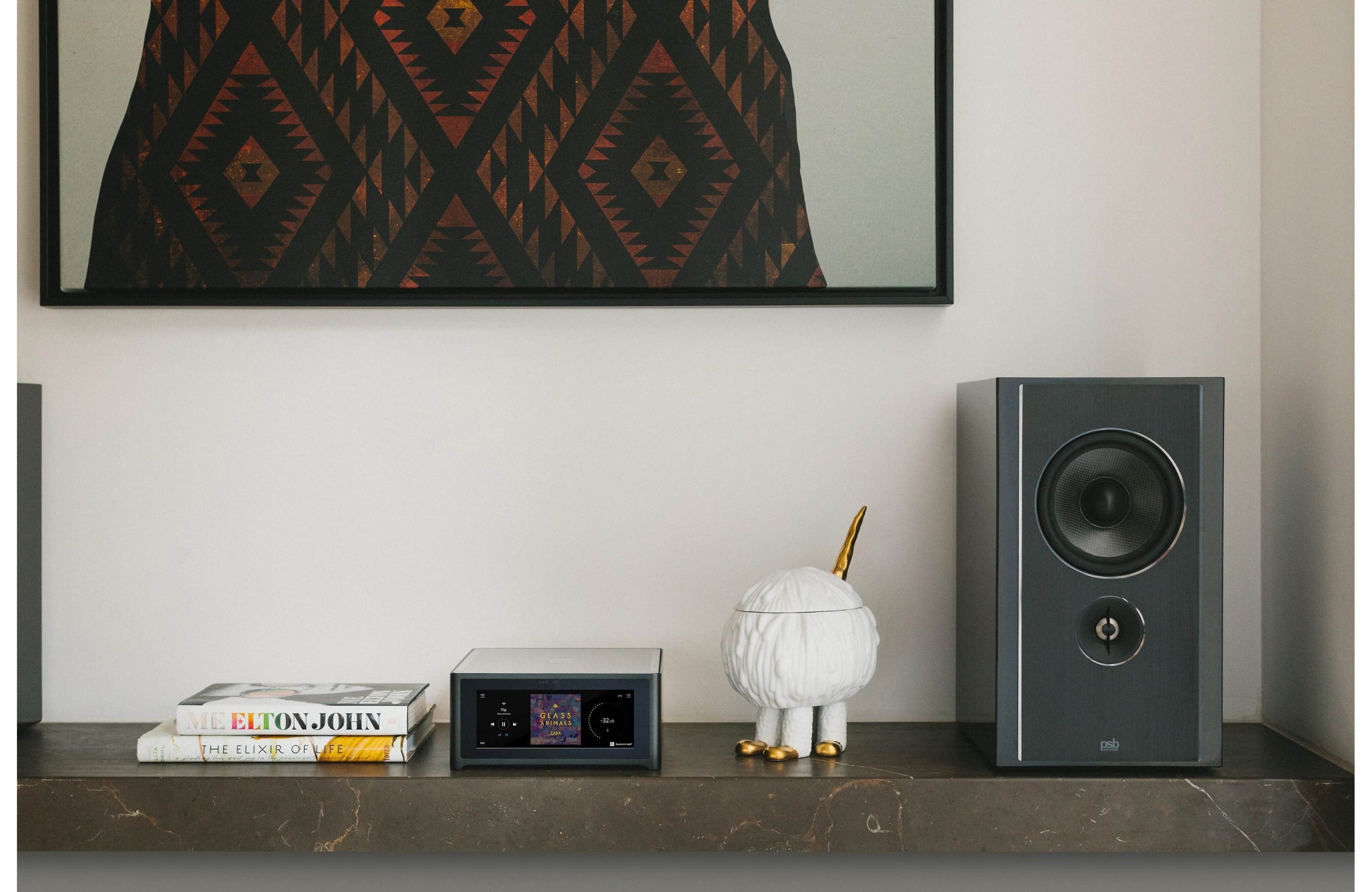NAD M10 V3 stereo amplifier with sleek black design and control knobs, showcasing high-end audio equipment for premium sound.