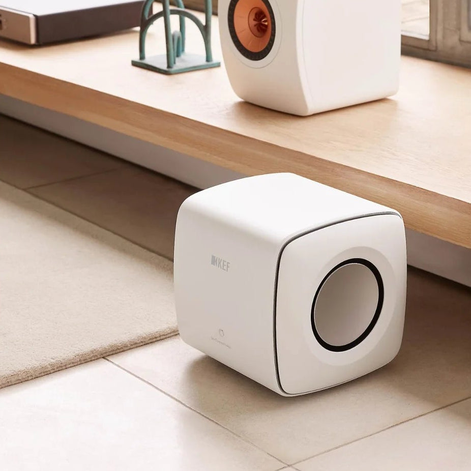 KEF KC62 subwoofer with sleek black enclosure and compact design, ideal for deep bass in home audio systems