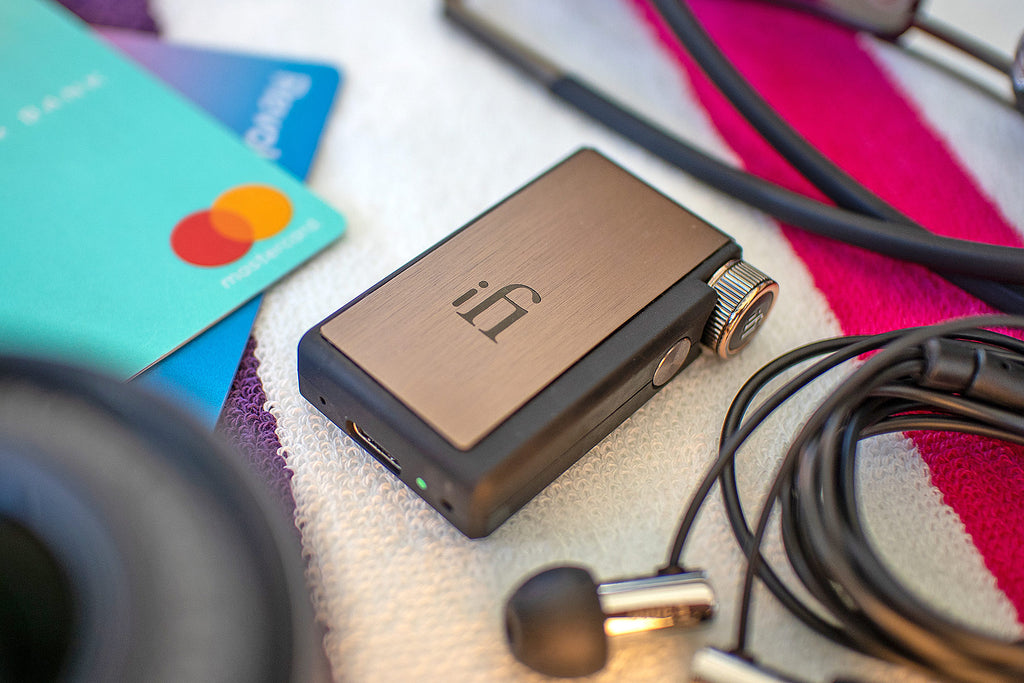 iFi Audio Go BLU headphone amplifier and DAC showing compact design with input and output ports.