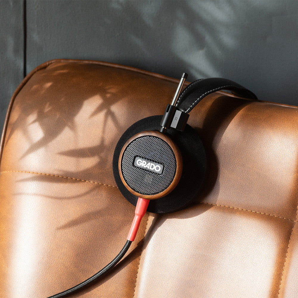 Wired Grado Signature S550 headphones with over-ear design and silver accents, shown from a side angle.