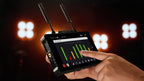 Hollyland Pyro 7 video monitor set showing two compact Hollyland Pyro 7 monitors with screens and control buttons.