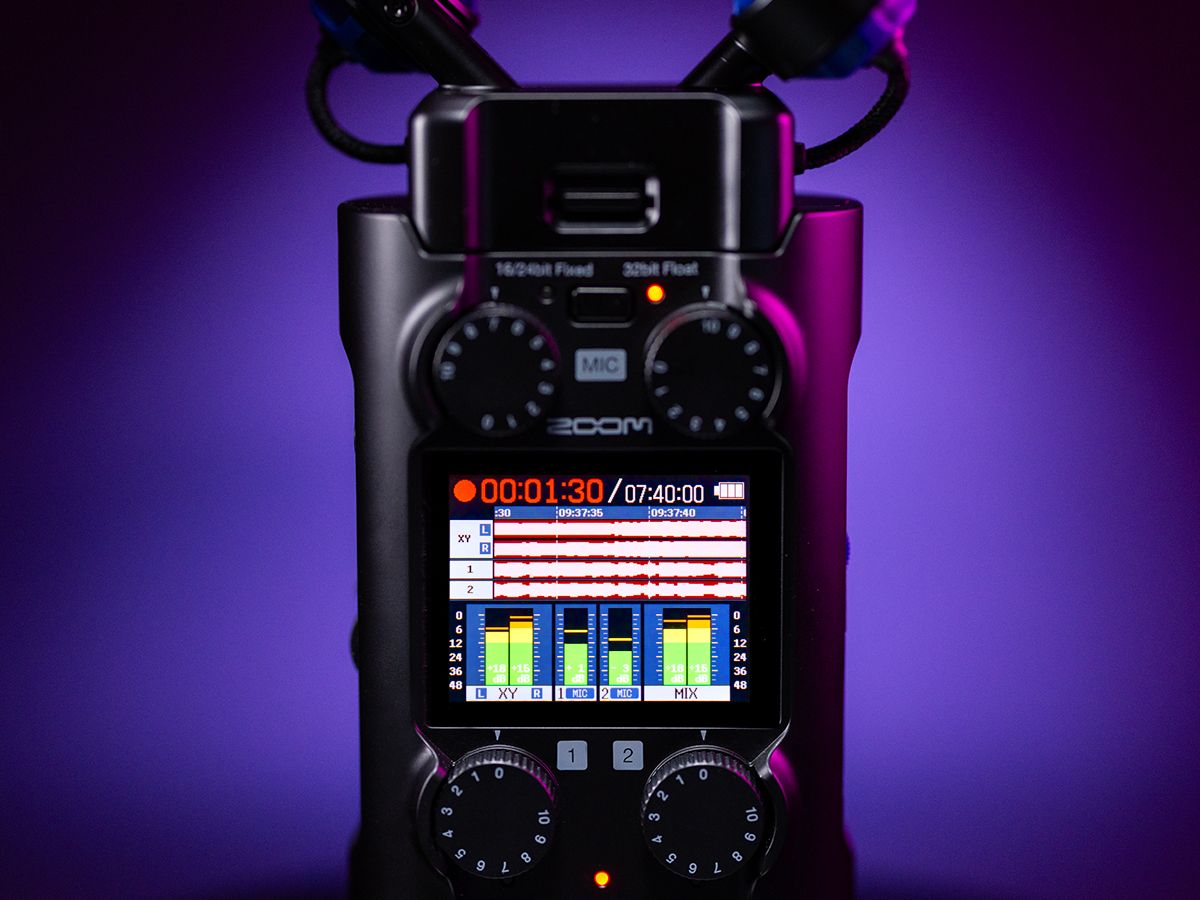Zoom H5 digital recorder with high-tech display showing controls and recording interface on a sleek, modern device.
