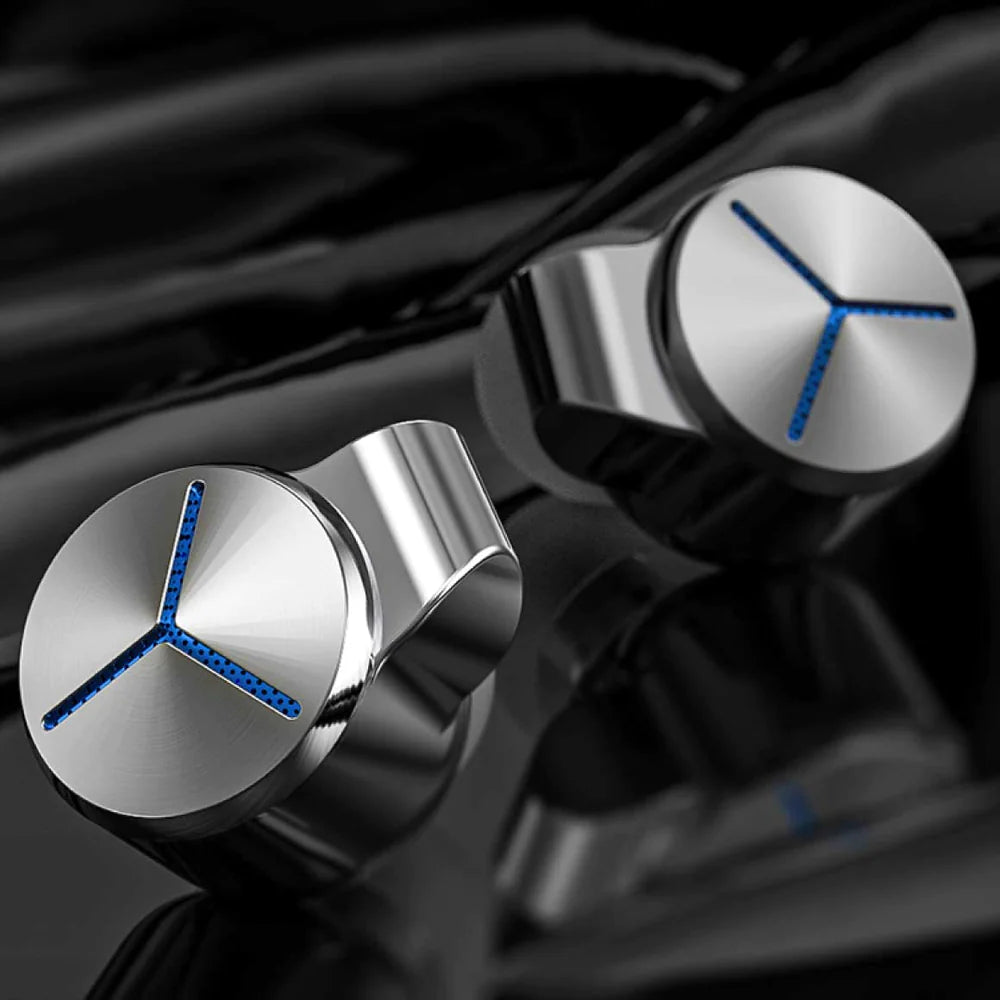 FiiO FA7S in-ear headphones with black earbuds and silver accents, showcasing detailed earphone design.