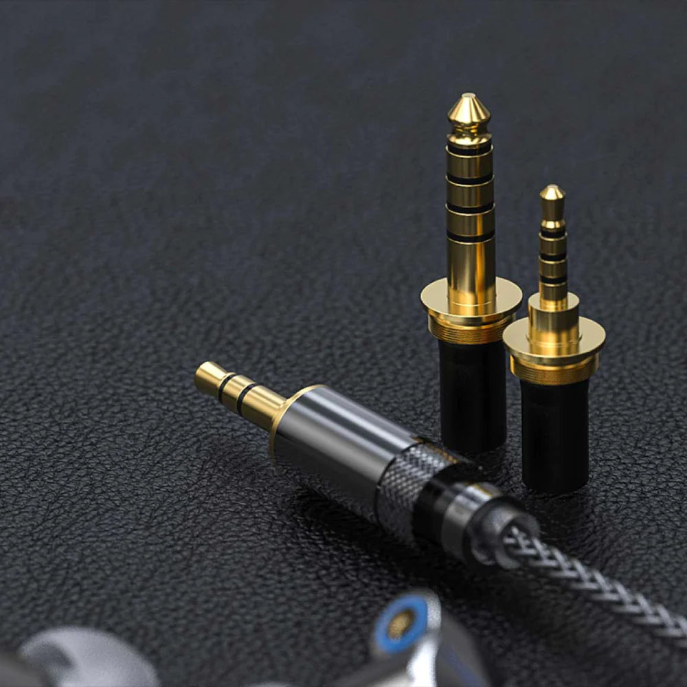 FiiO FA7S in-ear headphones with black and silver design, showcasing the sleek, ergonomic earbud fit and detailed audio drivers.