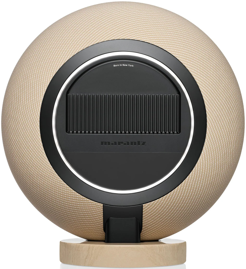 Marantz Horizon Grand wireless speaker in champagne finish, shown from the rear with detailed speaker grille and port openings.