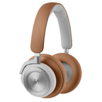 Bang & Olufsen Beoplay HX wireless headphones with timber-colored ear cups and sleek design, shown in close-up image.